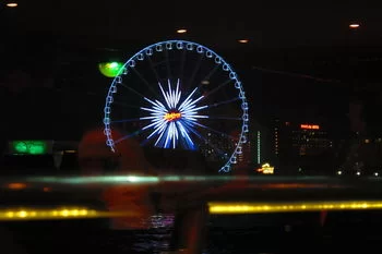 ferris-wheel-at-night-photo_12577830-350tall.webp