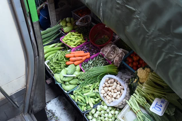 passing-maeklong-railway-market-veggies.webp