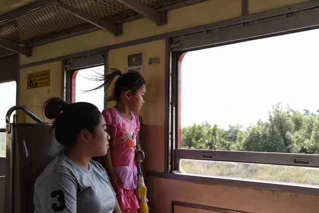 wind-through-girls-hair-on-train.webp